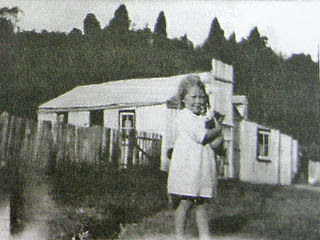 Noel's sister Phyllis outside my grandparents home in Waimiha.