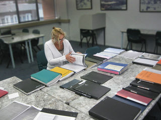 Research-Tanya researching through the Peterson and McNeights archival records.